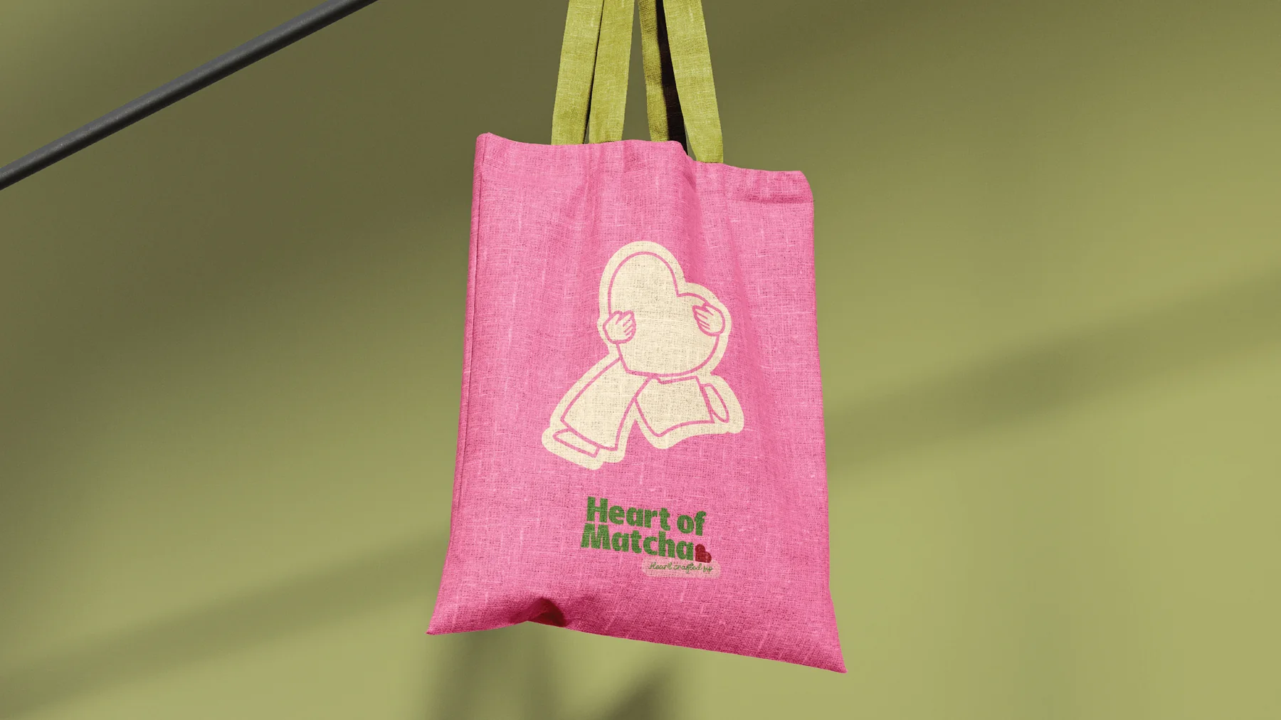 Pink Heart of Matcha tote bag printed with the heart mascot. Cafe merchandise design by LIRCLE